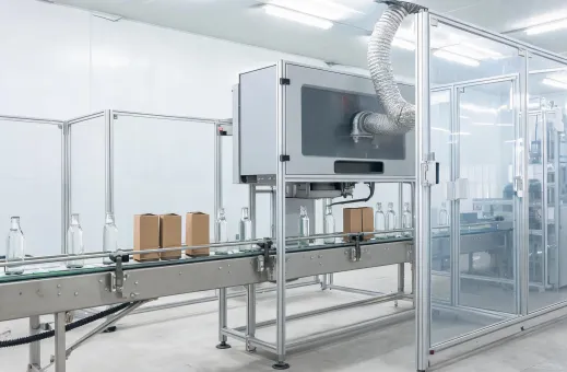 Enclosed CO2 laser marker over a packaging conveyor